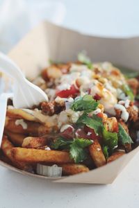 Close-up of loaded fries served on table