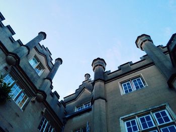 Low angle view of buildings against blue sky