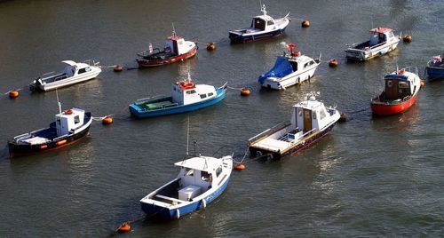 High angle view of boats moored in water
