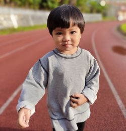 Portrait of boy standing outdoors