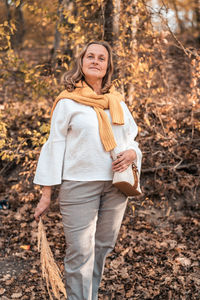 Portrait of a smiling woman in forest