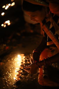 Man holding burning candle