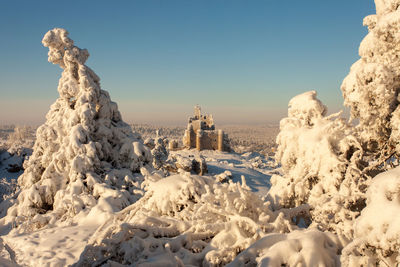 View of buildings against clear sky during winter