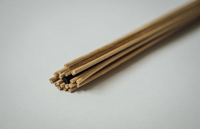 High angle view of pencils against white background