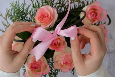 Woman florist making flowers bouquet flowers arrangement in box created by florist wedding gift.