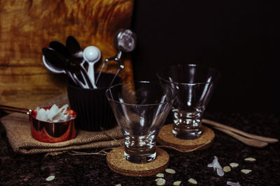 Close-up of wine glasses on table