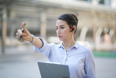Young woman using mobile phone