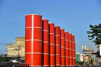 Low angle view of buildings against clear blue sky