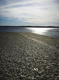 Scenic view of sea against cloudy sky