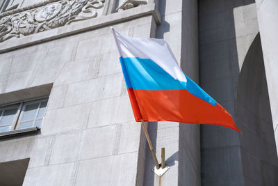 Russian flag. russian flag displayed on a pole in front house. national flag