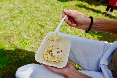 Midsection of man holding ice cream