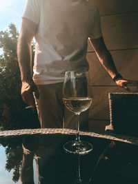 Midsection of man pouring water