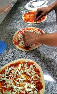 High angle view of person preparing food on table