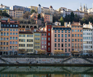 Buildings in city against sky