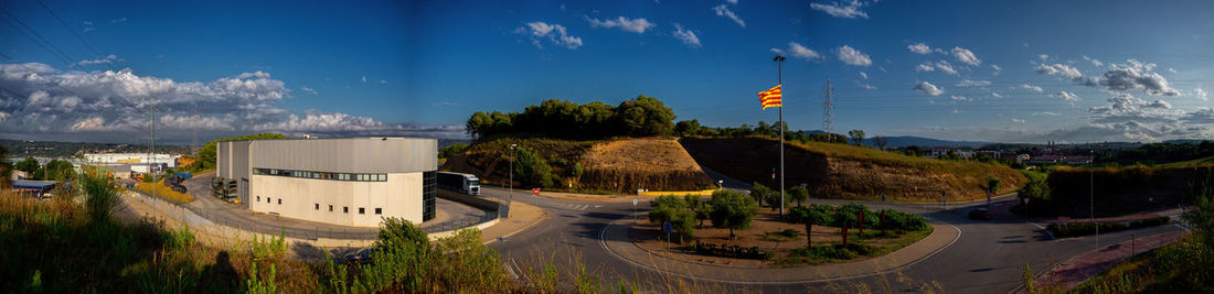 High angle view of road by trees against sky