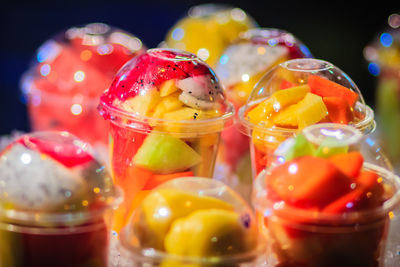 Close-up of multi colored candies in glass on table