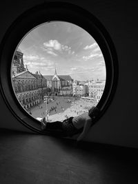 Laying on a window with a look to amsterdam  monochrome photography