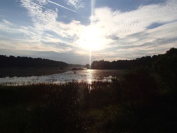Scenic view of lake against sky during sunset