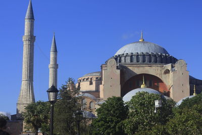 Low angle view of mosque against clear sky