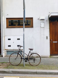 Bicycles parked against wall