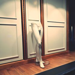 Close-up of mannequin on table at illuminated store