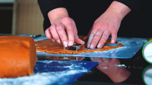 Midsection of man preparing food on table