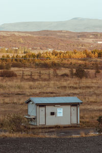 Built structure on field against sky