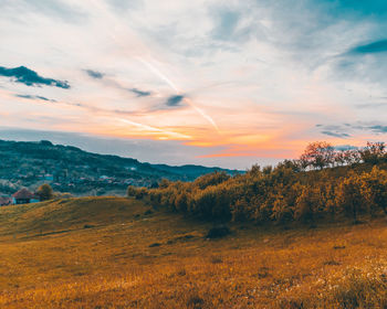 Scenic view of landscape against sky during sunset