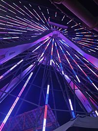 Low angle view of illuminated ferris wheel