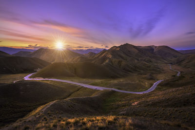 Scenic view of landscape against sky during sunset