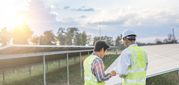 Engineers inspect and maintain solar power plants.  green energy innovation for life