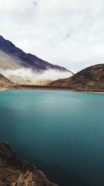 View of lake with mountain range in the background