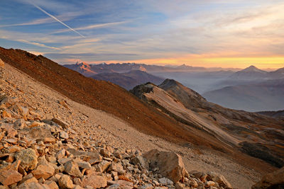 Scenic view of rocky mountains against sky during sunset