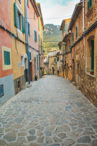 Footpath amidst buildings in town