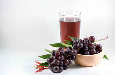 Close-up of drink against white background