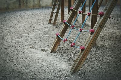 Close-up of clothes hanging on sand