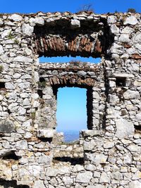 Low angle view of old ruins against clear sky