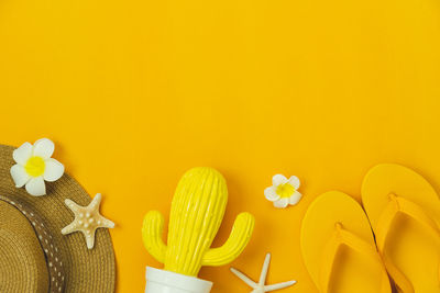 Close-up of yellow flowers on table