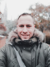 Portrait of smiling man in snow