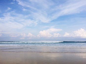 Scenic view of beach and sea against sky