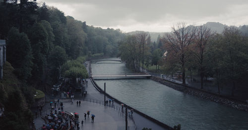 High angle view of people walking on riverbank