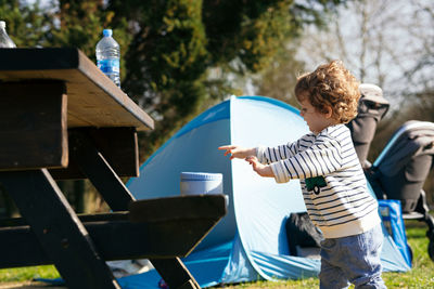 Rear view of boy standing