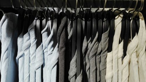 Close-up of clothes drying on display at store