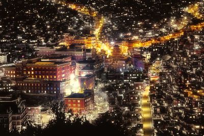 View of illuminated street lights at night