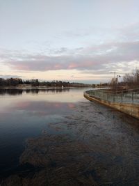 Scenic view of lake against sky during sunset