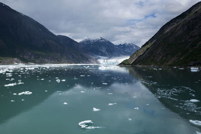 Scenic view of an alaskan glacier and mountains against sky