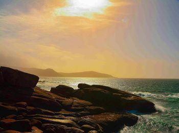 Scenic view of sea against sky during sunset