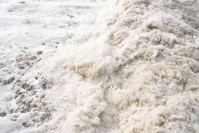 High angle view of surf on beach