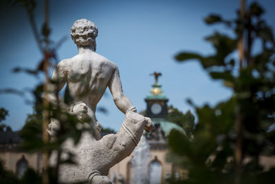 Low angle view of statue against sky