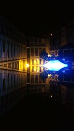 Illuminated buildings in city at night